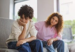 mom trying to talk to depressed son