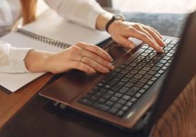 parent researching on laptop